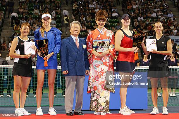 Ai Sugiyama of Japan and Daniela Hantuchova of Slovakia and Alisa Kleybanova of Russia and Francesca Schiavone of Italy hold their trophies after...