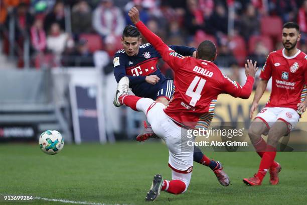James Rodriguez of Bayern Muenchen scores a goal to make it 2:0 during the Bundesliga match between 1. FSV Mainz 05 and FC Bayern Muenchen at Opel...