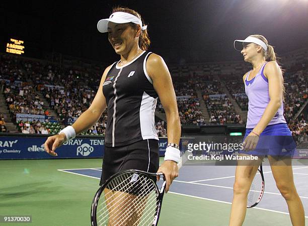 Ai Sugiyama of Japan and Daniela Hantuchova of Slovakia walk from the court in their doubles final match against Francesca Schiavone of Italy and...