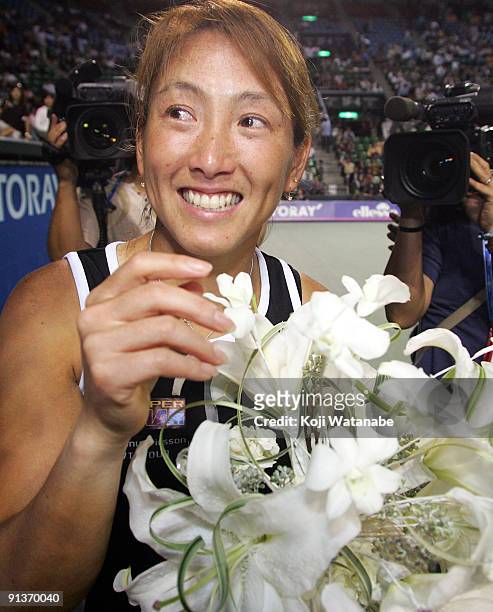 Ai Sugiyama of Japan smiles during a ceremony on day seven of the Toray Pan Pacific Open Tennis tournament at Ariake Colosseum on October 3, 2009 in...