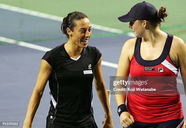 Francesca Schiavone of Italy and Alisa Kleybanova of Russia talk during their doubles match against Ai Sugiyama of Japan and Daniela Hantuchova of...