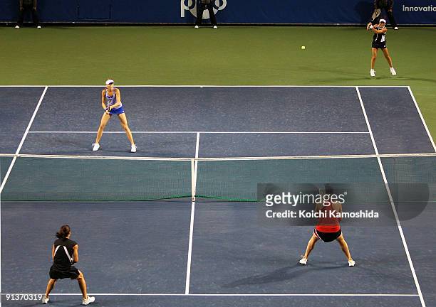 Ai Sugiyama of Japan and Daniela Hantuchova of Slovakia to return the ball in the doubles final match against Francesca Schiavone of Italy and Alisa...