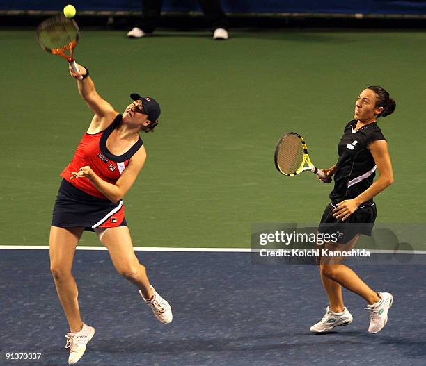 Francesca Schiavone of Italy and Alisa Kleybanova of Russia to return the ball in the doubles final match against Ai Sugiyama of Japan and Daniela...