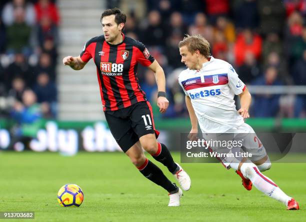 Moritz Bauer of Stoke City chases down Charlie Daniels of AFC Bournemouth during the Premier League match between AFC Bournemouth and Stoke City at...