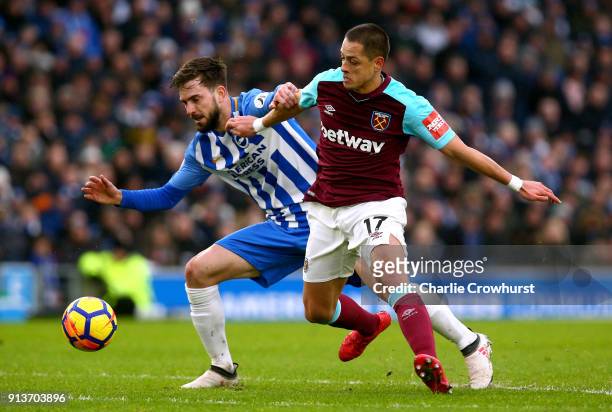 Javier Hernandez of West Ham United and Davy Propper of Brighton and Hove Albion battle for the ball during the Premier League match between Brighton...