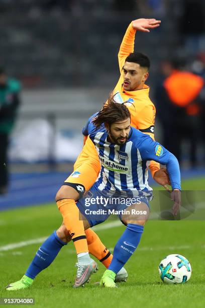 Nadiem Amiri of Hoffenheim fights for the ball with Marvin Plattenhardt of Berlin during the Bundesliga match between Hertha BSC and TSG 1899...