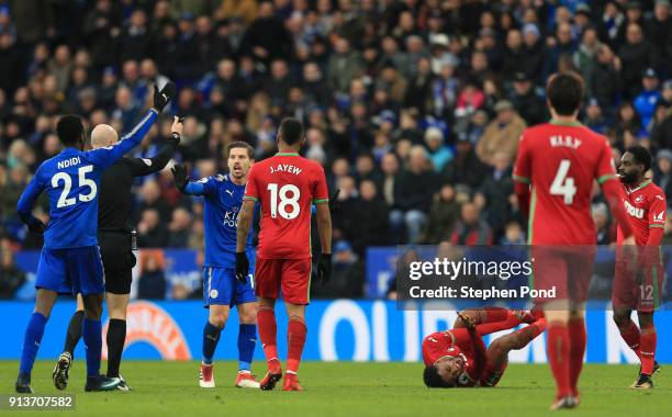 Leroy Fer of Swansea City goes down injured during the Premier League match between Leicester City and Swansea City at The King Power Stadium on...