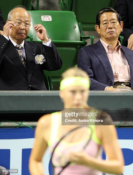 Former chief cabinet secretary Nobutaka Machimura watches Maria Sharapova of Russia playing in the women's final match against Jelena Jankovic of...