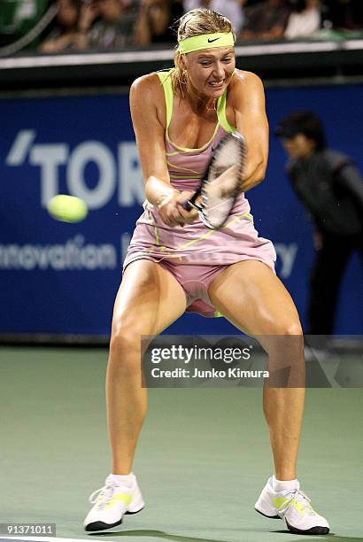 Maria Sharapova of Russia plays a backhand in the women's final match against Jelena Jankovic of Serbia during day seven of the Toray Pan Pacific...