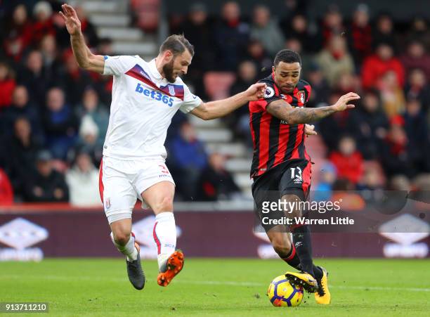 Callum Wilson of AFC Bournemouth shoots and misses past Erik Pieters of Stoke City during the Premier League match between AFC Bournemouth and Stoke...