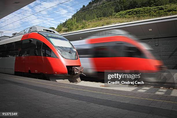 two fast modern trains at the station - electric train stock pictures, royalty-free photos & images