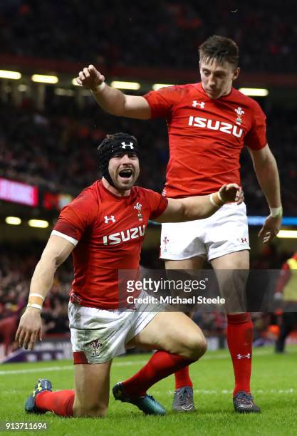 Leigh Halfpenny of Wales celebrates scoring his sides third try during the Natwest Six Nations round One match between Wales and Scotland at...