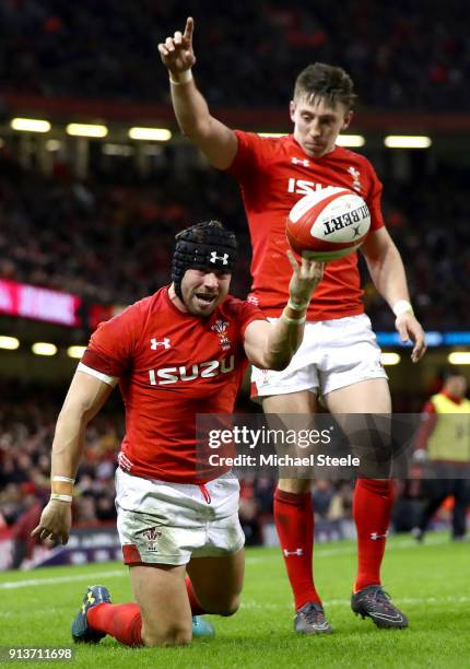 Leigh Halfpenny of Wales celebrates scoring his sides third try during the Natwest Six Nations round One match between Wales and Scotland at...