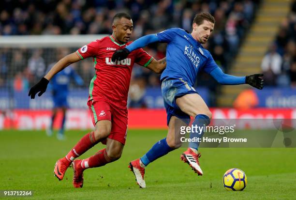 Adrien Silva of Leicester City battles for possesion with Jordan Ayew of Swansea City during the Premier League match between Leicester City and...
