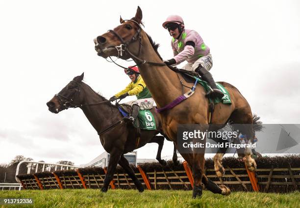 Dublin , Ireland - 3 February 2018; Supasundae, with Robbie Power up, left, clears the last next to Faugheen, with Paul Townend up, on their way to...