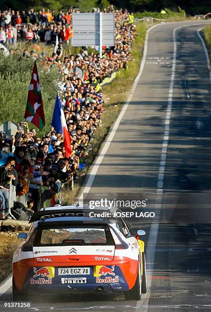French Sebastien Loeb and co-driver Daniel Elena drive their Citroen during the second stage of the 45th Rally of Catalonia in El Molar near...