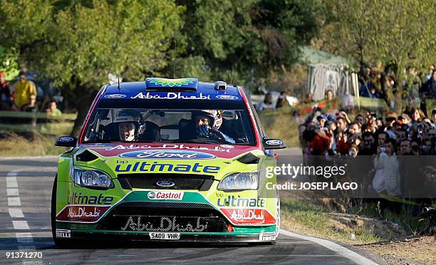 Finland's Mikko Hirvonen and co-driver Jarmo Lehtinen drive their Ford Focus during the second stage of the 45th Rally of Catalonia in El Molar near...