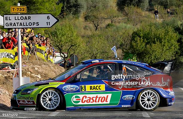 Finland's Mikko Hirvonen and co-driver Jarmo Lehtinen drive their Ford Focus during the second stage of the 45th Rally of Catalonia in El Molar near...