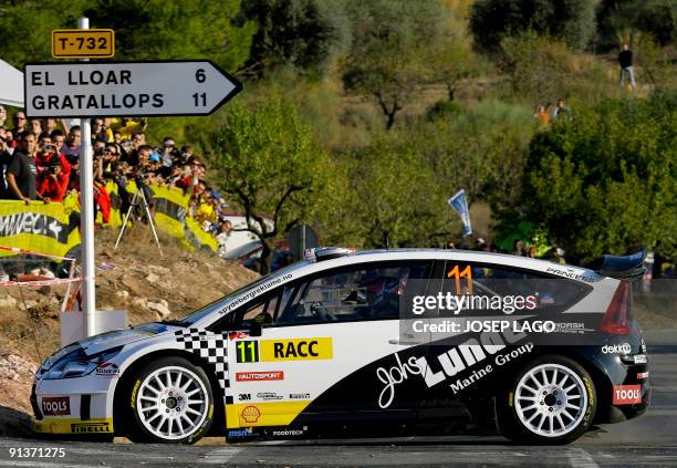 Norwegian Petter Solberg and his British co-driver Phil Mills drive their Citroen during the second stage of the 45th Rally of Catalonia in El Molar...