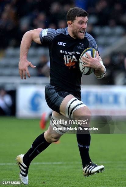 Mark Wilson of Newcastle Falcons breaks free from a tackle before scoring a try in the first half during the Anglo-Welsh Cup match between Newcastle...
