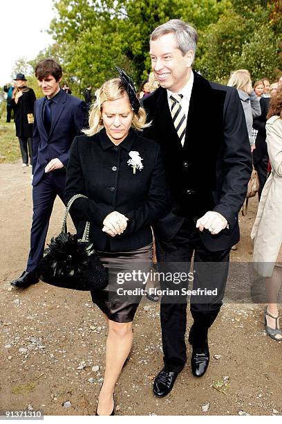 Thomas Hermanns plus guest and his husband Wolfgang Macht leave the church wedding of Barbara Schoeneberger and Maximilian von Schierstaedt at the...