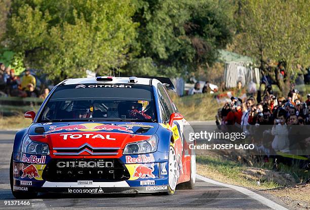 French Sebastien Loeb and co-driver Daniel Elena drive their Citroen during the second stage of the 45th Rally of Catalonia in El Molar near...