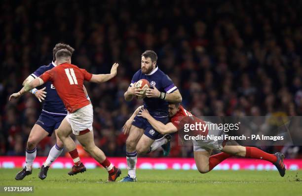 Scotland's Tommy Seymour is tackled by Wales' Owen Watkin during the NatWest 6 Nations match at the Principality Stadium, Cardiff.