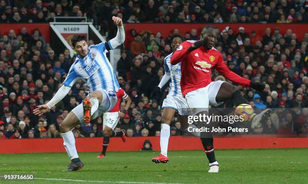 Romelu Lukaku of Manchester United scores their first goal during the Premier League match between Manchester United and Huddersfield Town at Old...