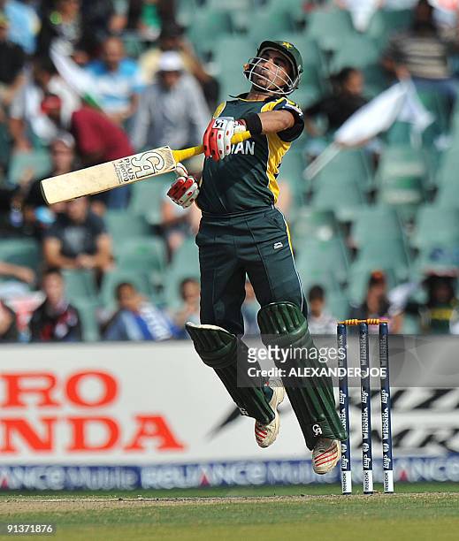 Pakistan's opening batsman Imran Nazir avoids a bouncer from New Zealand's cricketer Shane Bond during ICC Champions Trophy 2nd semi final between...