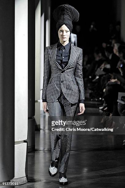 Model walks the runway during the Junya Watanabe Pret a Porter show during Paris Womenswear Fashion Week Spring/Summer 2010 on October 3, 2009 in...