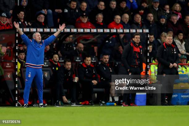 Paul Lambert, Manager of Stoke City reacts as Eddie Howe, Manager of AFC Bournemouth looks on during the Premier League match between AFC Bournemouth...