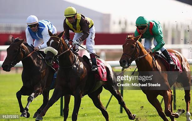 Varenar ridden by Stephan Pasquier wins the Total Prix de la Foret race from Sweet Hearth ridden by Gerard Mosse and Goldikova ridden by Olivier...