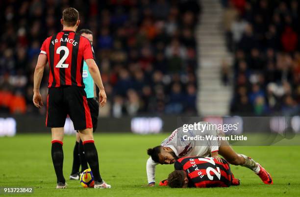 Maxim Choupo-Moting of Stoke City checks if Ryan Fraser of AFC Bournemouth is ok during the Premier League match between AFC Bournemouth and Stoke...