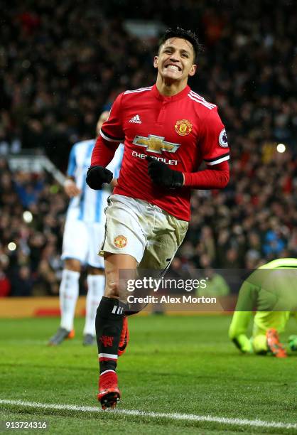 Alexis Sanchez of Manchester United celebrates after scoring his sides second goal during the Premier League match between Manchester United and...