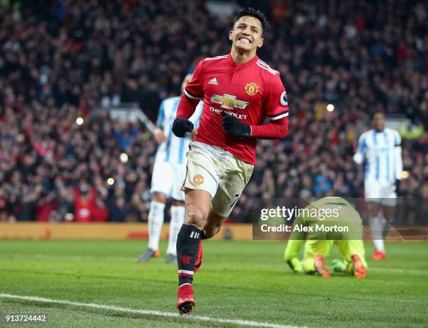 Alexis Sanchez of Manchester United celebrates after scoring his sides second goal during the Premier League match between Manchester United and...