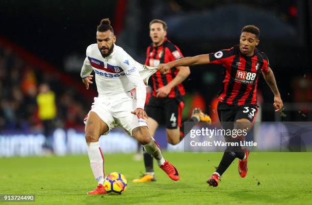 Maxim Choupo-Moting of Stoke City is challenged by Jordon Ibe of AFC Bournemouth during the Premier League match between AFC Bournemouth and Stoke...