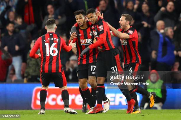 Joshua King of AFC Bournemouth celebrates scoring his side's first goal with team mates during the Premier League match between AFC Bournemouth and...