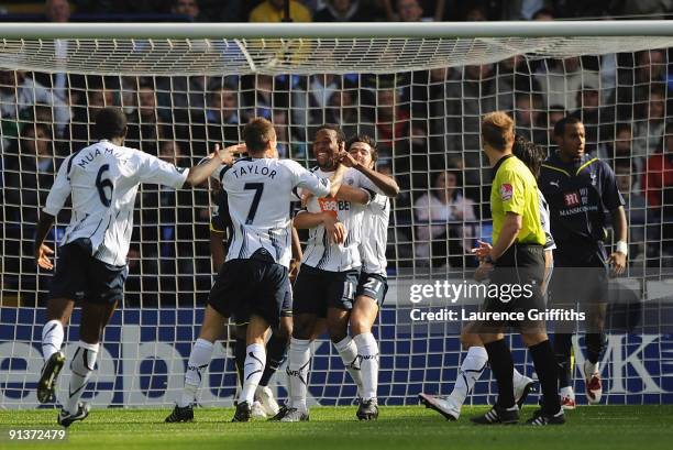 Ricardo Gardner of Bolton is congratulated on scoring the opening goal during the Barclays Premier League match between Bolton Wanderers and...
