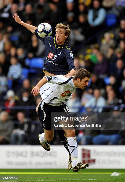 Peter Crouch of Tottenham Hotspur battles with Sam Ricketts of Bolton during the Barclays Premier League match between Bolton Wanderers and Tottenham...