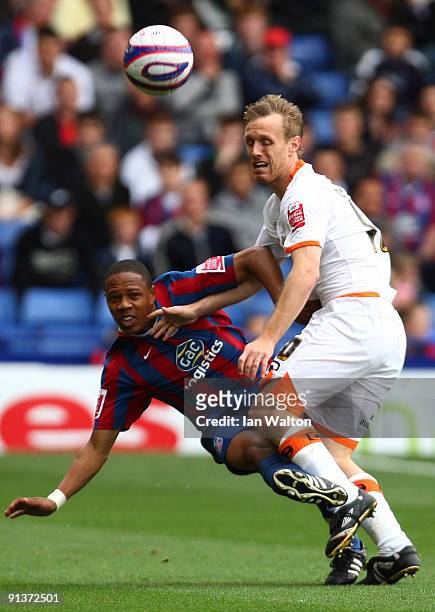 Brett Ormerid of Blackpool tries to tackle Nathaniel Clyne of Crystal Palace during the Coca Cola Championship match between Crystal Palace and...
