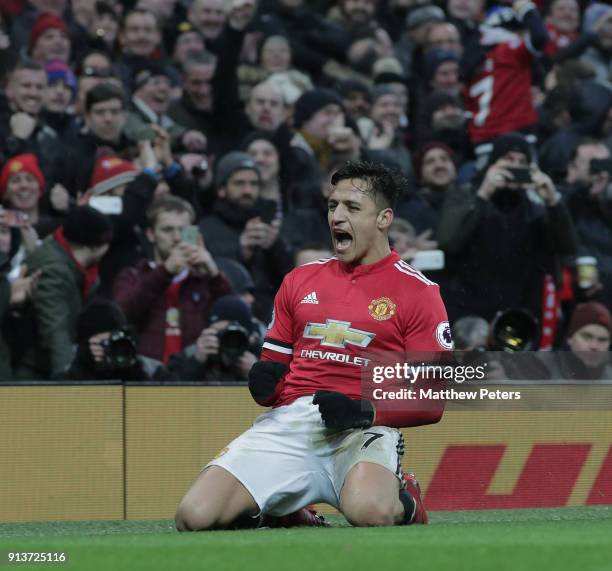 Alexis Sanchez of Manchester United celebrates scoring their second goal during the Premier League match between Manchester United and Huddersfield...