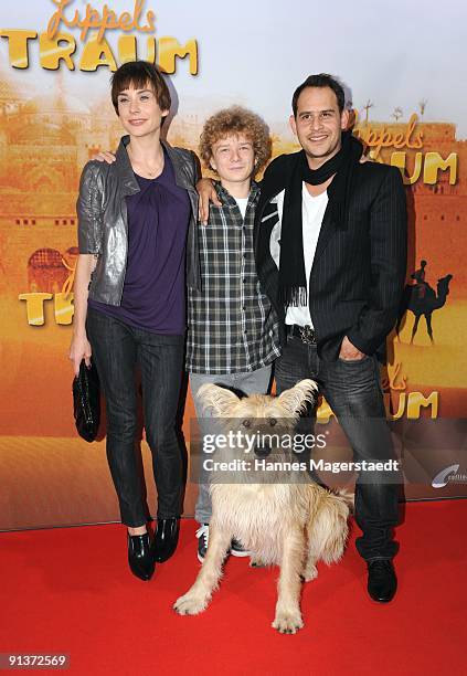 Actress Christiane Paul, Karl Alexander Seidel, Moritz Bleibreu and dog Muck attend the premiere of "Lippels Traum" at the MaxxX Filmpalast on...