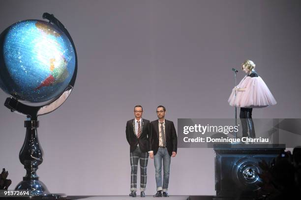 Viktor Horsting and Rolf Snoeren walk the runway while Roisin Murphy performs during the Viktor & Rolf Spring / Summer 2010 Pret a Porter show as...