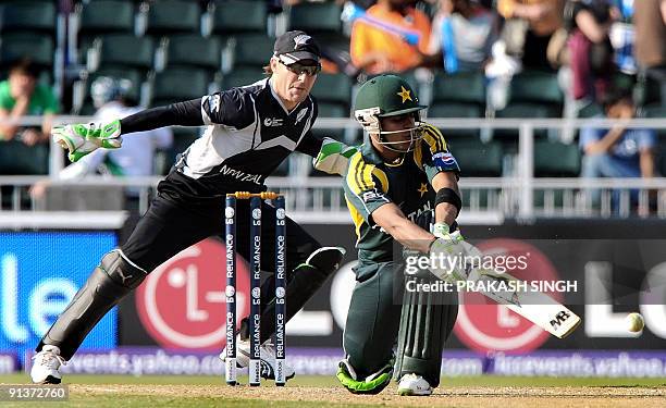 New Zealand's wicket keeper Brendon McCullum watches as Pakistan's Omer Akmal plays a shot during the ICC Champions Trophy's second semi final match...