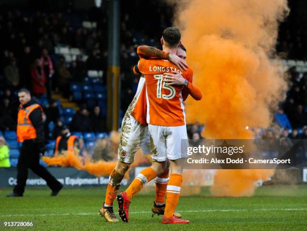 Blackpool's Sean Longstaff celebrates scoring his side's first goal with teammate Callum Cooke during the Sky Bet League One match between Bury and...