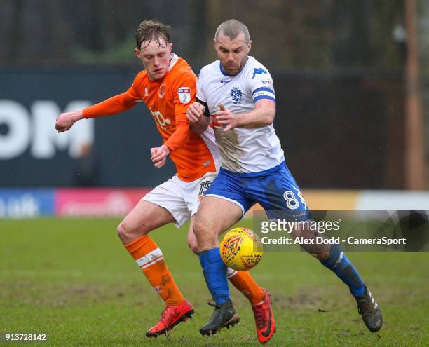Blackpool's Sean Longstaff is shoved off the ball by Bury's Stephen Dawson during the Sky Bet League One match between Bury and Blackpool at Gigg...