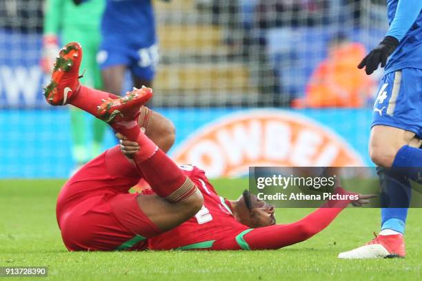 Leroy Fer of Swansea holds his ankle after falling to the ground during the Premier League match between Leicester City and Swansea City at the...