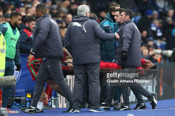 Leroy Fer of Swansea is stretchered off after injuring his ankle during the Premier League match between Leicester City and Swansea City at the...