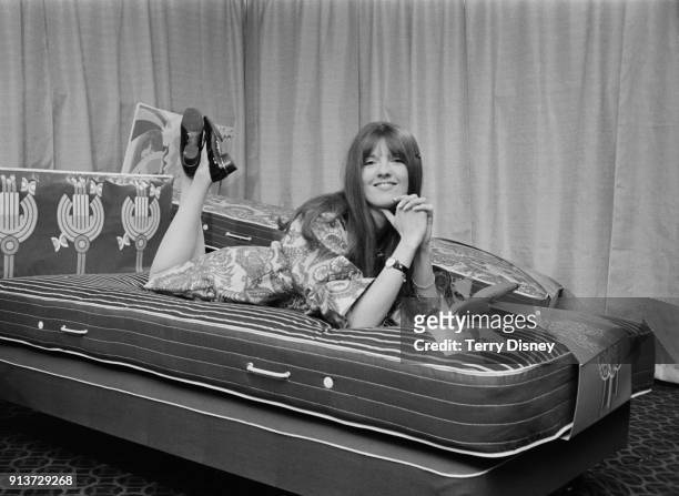 British broadcaster and journalist Cathy McGowan on a bed she has designed, London, UK, 25th January 1968.