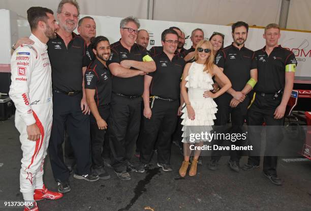 Kylie Minogue poses with members of the Dragon Racing team including Formula E racing driver Jose Maria Lopez at the ABB FIA Formula E Antofagasta...